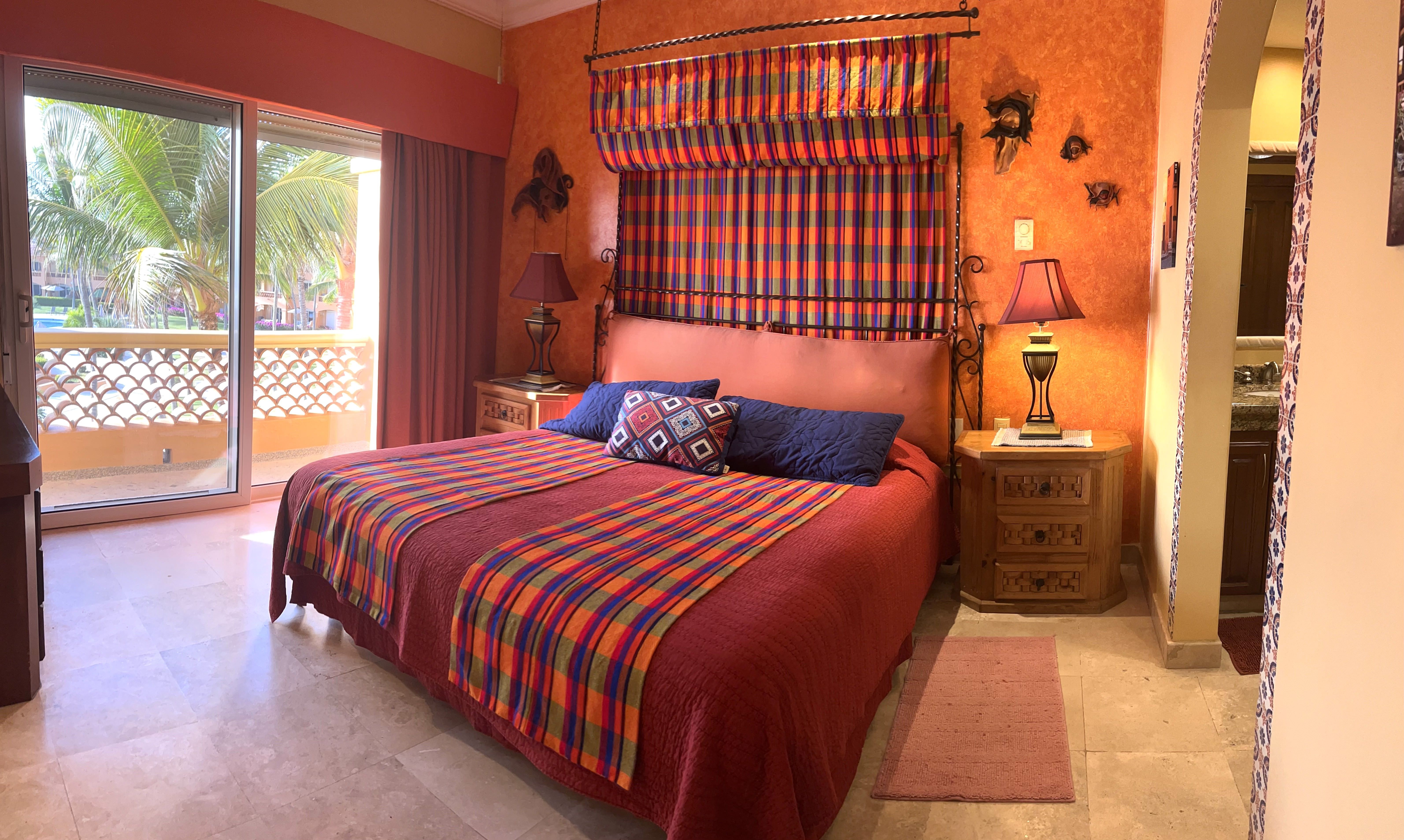 The master bedroom shares the deck, the view and the sound of the surf.